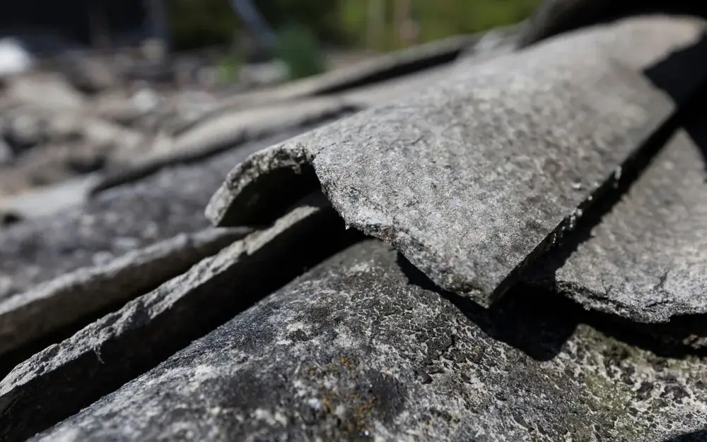Weathered asbestos cement roof sheeting